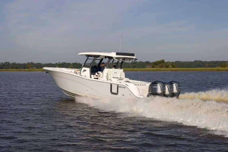 Black Label Marine Group Yacht Photos Pics 2025 Sea Fox 368 Commander Center Console boat cruising on a lake.