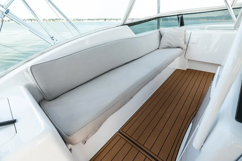 Amp'd Up Yacht Photos Pics Luxurious seating area on a 1999 Hatteras 60 Convertible yacht with teak flooring.