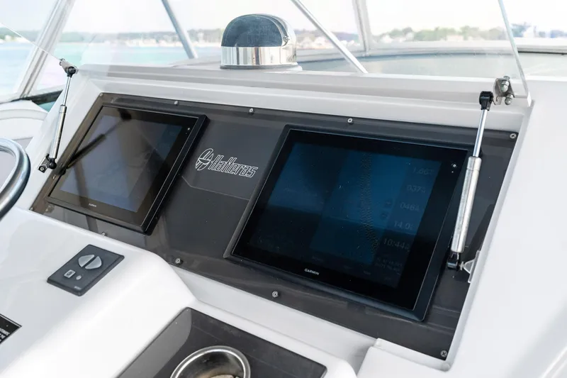 Amp'd Up Yacht Photos Pics Control panel of 1999 Hatteras 60 Convertible yacht with dual Garmin displays.