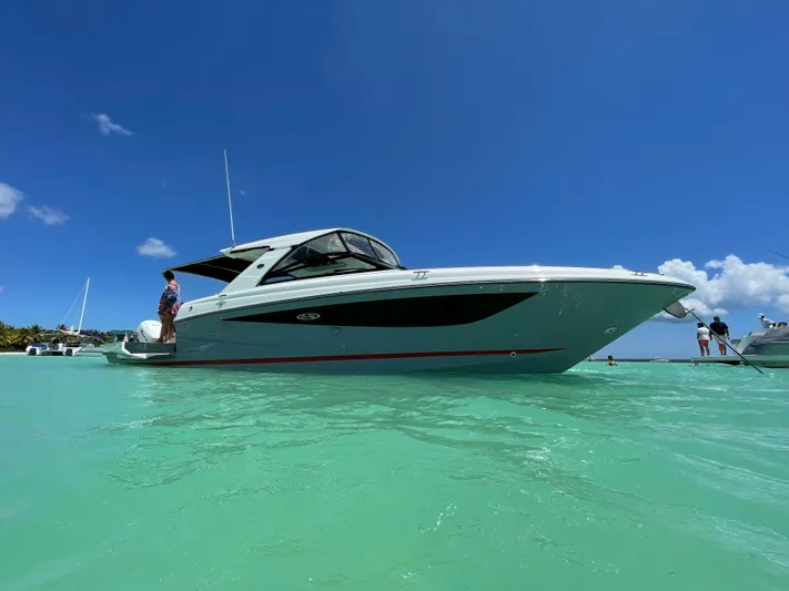  Yacht Photos Pics 2020 Sea Ray SLX boat on turquoise water under clear blue sky.