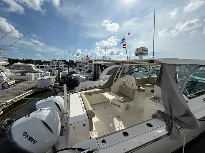  Yacht Photos Pics 2017 Pursuit DC 325 Dual Console boat docked, featuring Yamaha engines and spacious seating.