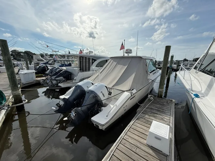  Yacht Photos Pics 2017 Pursuit DC 325 Dual Console boat docked with twin Yamaha outboard engines.