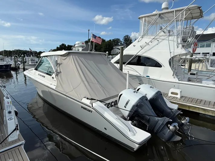  Yacht Photos Pics 2017 Pursuit DC 325 Dual Console boat docked with twin Yamaha engines.
