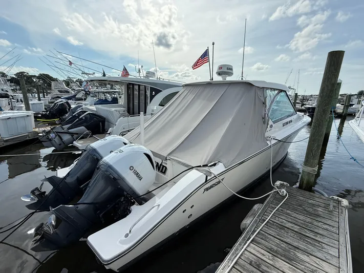  Yacht Photos Pics 2017 Pursuit DC 325 Dual Console boat docked with Yamaha outboard engines.