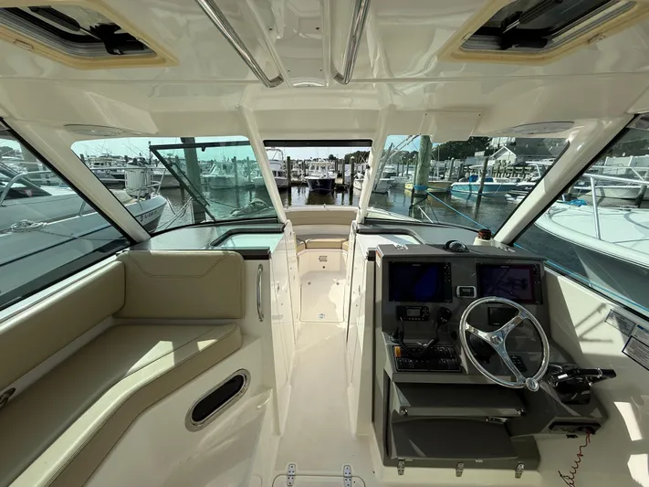  Yacht Photos Pics Interior view of 2017 Pursuit DC 325 Dual Console boat at marina.