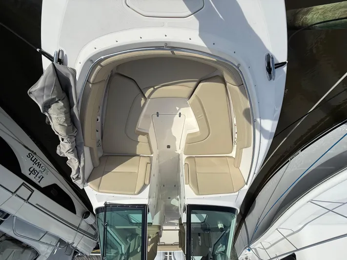  Yacht Photos Pics 2017 Pursuit DC 325 Dual Console boat interior with beige seating and open deck layout.