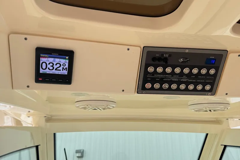  Yacht Photos Pics Control panel of a 2019 Scout 350 LXF boat with digital display and switches.