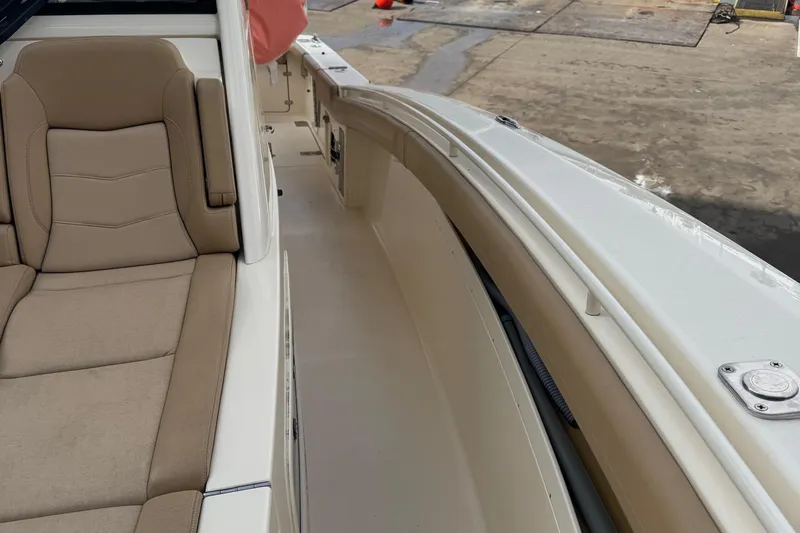 Yacht Photos Pics 2019 Scout 350 LXF boat interior with beige seating and sleek design.