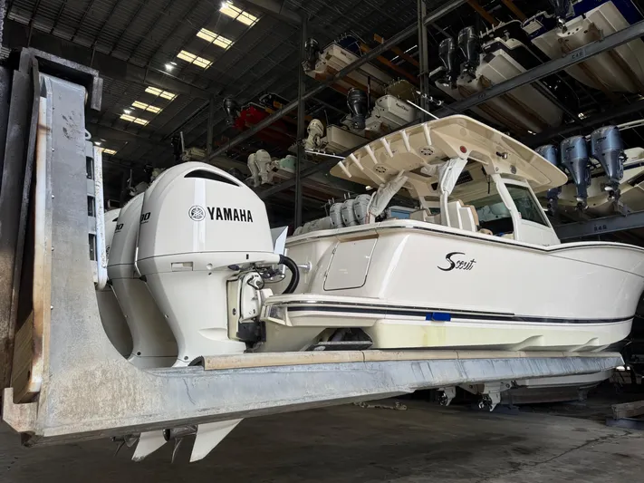  Yacht Photos Pics 2019 Scout 350 LXF boat with Yamaha engines in storage facility.
