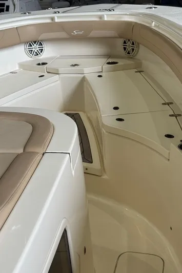  Yacht Photos Pics 2019 Scout 350 LXF boat interior with beige seating and storage compartments.