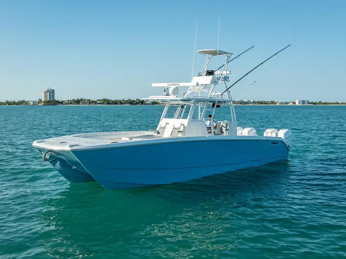  Yacht Photos Pics 2023 Invincible 37 Catamaran on clear blue water, showcasing sleek design and modern features.