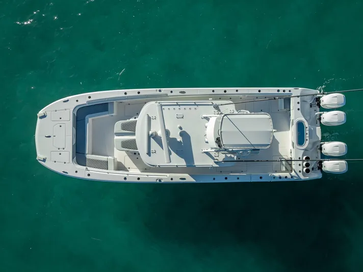  Yacht Photos Pics Aerial view of 2023 Invincible 37 Catamaran on turquoise water.