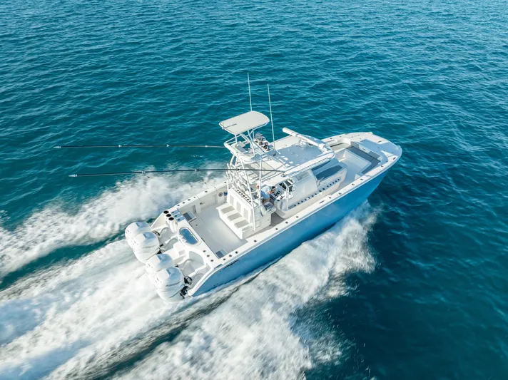  Yacht Photos Pics 2023 Invincible 37 Catamaran cruising on open blue waters.