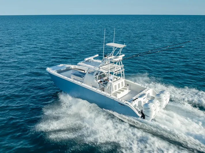  Yacht Photos Pics 2023 Invincible 37 Catamaran cruising on open ocean waters.