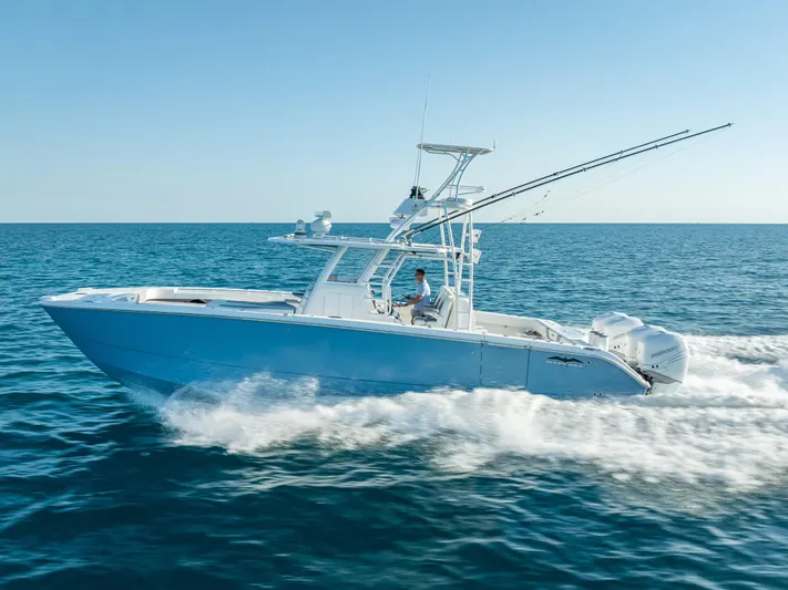  Yacht Photos Pics 2023 Invincible 37 Catamaran cruising on open sea, showcasing sleek design and powerful performance.