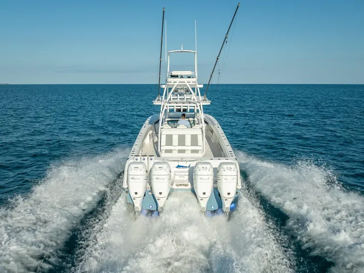  Yacht Photos Pics 2023 Invincible 37 Catamaran cruising on open sea with powerful engines.