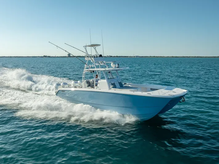  Yacht Photos Pics 2023 Invincible 37 Catamaran cruising on open water, showcasing sleek design and performance.