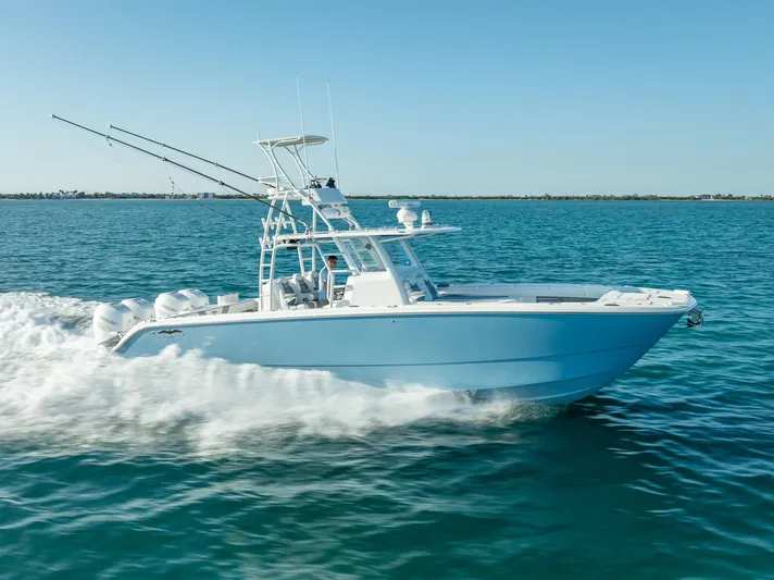  Yacht Photos Pics 2023 Invincible 37 Catamaran cruising on open water, showcasing sleek design and powerful performance.