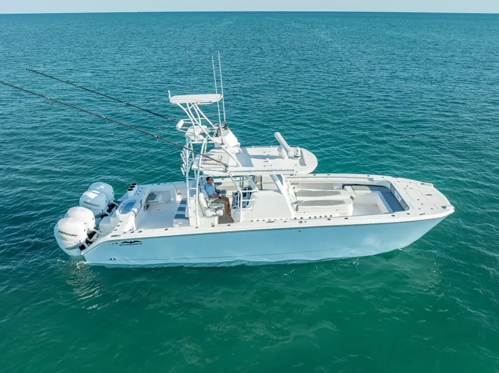  Yacht Photos Pics 2023 Invincible 37 Catamaran on open water, showcasing sleek design and powerful engines.