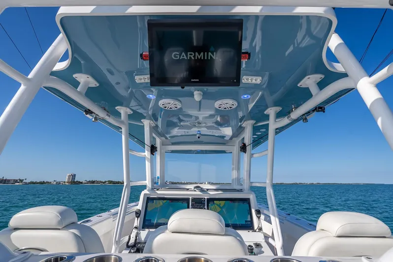  Yacht Photos Pics 2023 Invincible 37 Catamaran helm with Garmin display, ocean view in background.