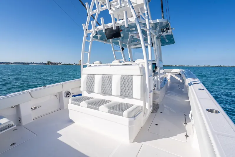  Yacht Photos Pics 2023 Invincible 37 Catamaran with spacious seating on open water.