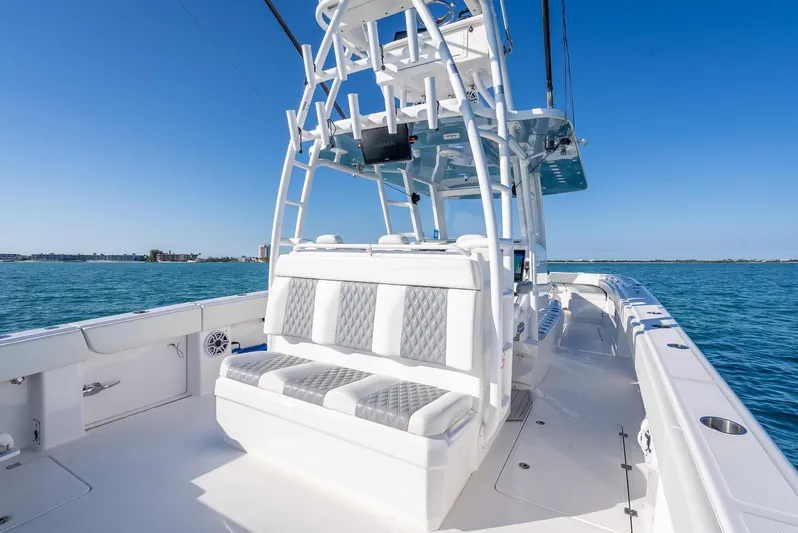  Yacht Photos Pics 2023 Invincible 37 Catamaran on open water, featuring sleek seating and modern design.