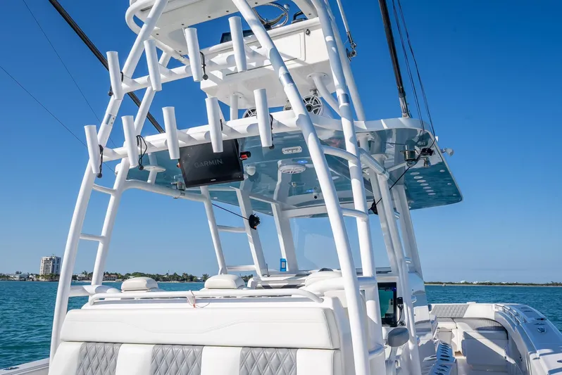  Yacht Photos Pics 2023 Invincible 37 Catamaran with sleek design, white tower, and ocean backdrop.