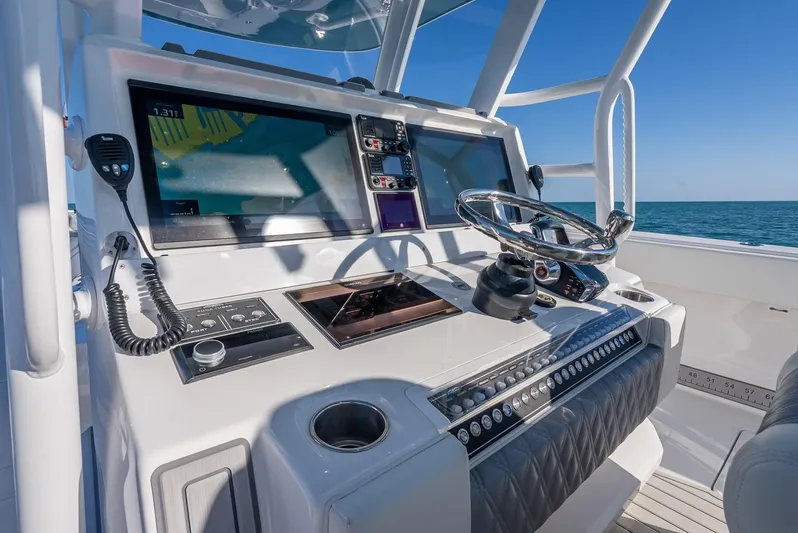  Yacht Photos Pics Helm of 2023 Invincible 37 Catamaran with advanced navigation systems and ocean view.