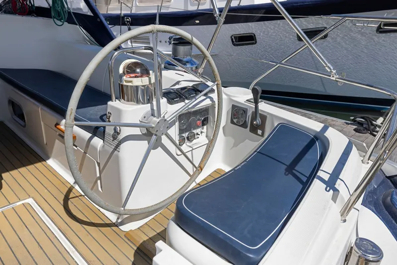 Crazy Horse Yacht Photos Pics Cockpit of 2001 Jeanneau Sun Odyssey 52.2 sailboat with steering wheel and controls.