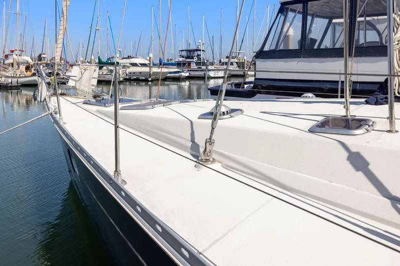 Crazy Horse Yacht Photos Pics Jeanneau Sun Odyssey 52.2 sailboat docked in marina, 2001 model, sunny day.