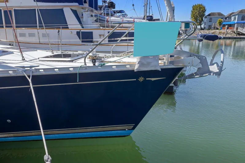 Crazy Horse Yacht Photos Pics Jeanneau Sun Odyssey 52.2 yacht docked in marina, 2001 model, blue hull.