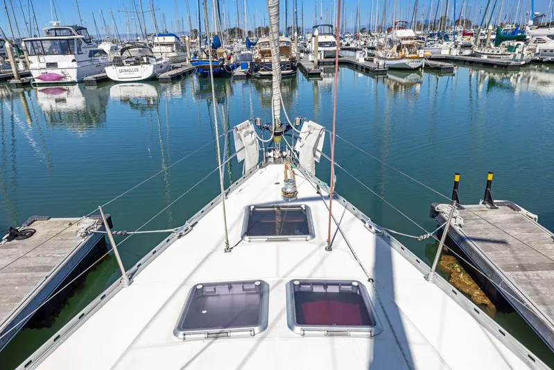 Crazy Horse Yacht Photos Pics Jeanneau Sun Odyssey 52.2 sailboat docked in a marina, 2001 model.