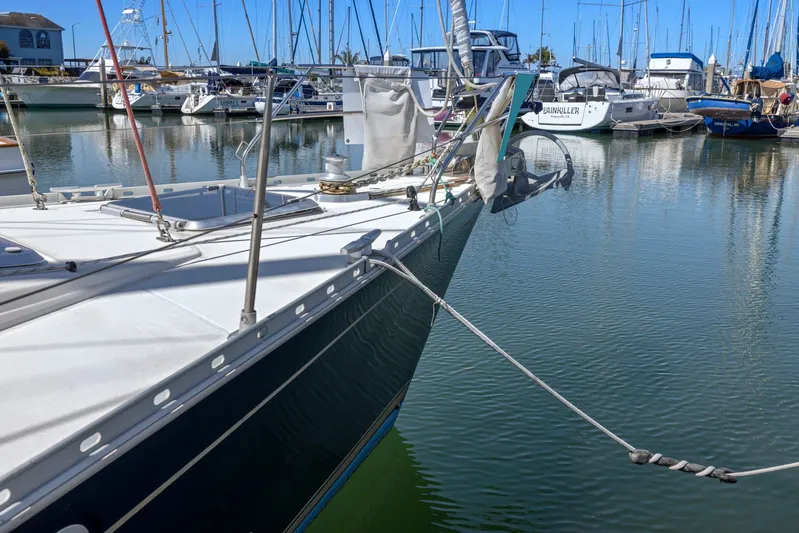 Crazy Horse Yacht Photos Pics Jeanneau Sun Odyssey 52.2 yacht docked in marina, 2001 model, surrounded by other boats.