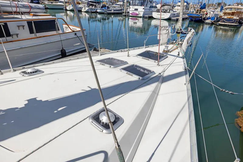 Crazy Horse Yacht Photos Pics Jeanneau Sun Odyssey 52.2 sailboat deck, 2001 model, docked in a marina.