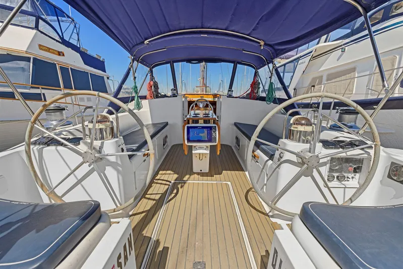 Crazy Horse Yacht Photos Pics Cockpit of 2001 Jeanneau Sun Odyssey 52.2 sailboat with dual steering wheels.