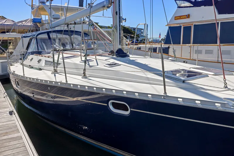 Crazy Horse Yacht Photos Pics Jeanneau Sun Odyssey 52.2 sailboat, 2001 model, docked at marina.