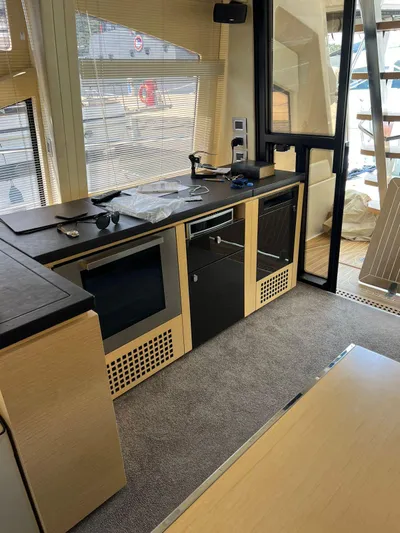  Yacht Photos Pics Interior of 2012 Cranchi Sixty 6 Fly Yacht with modern kitchen amenities.