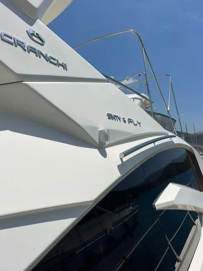  Yacht Photos Pics 2012 Cranchi Sixty 6 Fly Yacht, sleek design, sunny day, docked at marina.