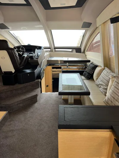  Yacht Photos Pics Luxurious interior of 2012 Cranchi Sixty 6 Fly Yacht with plush seating and modern design.