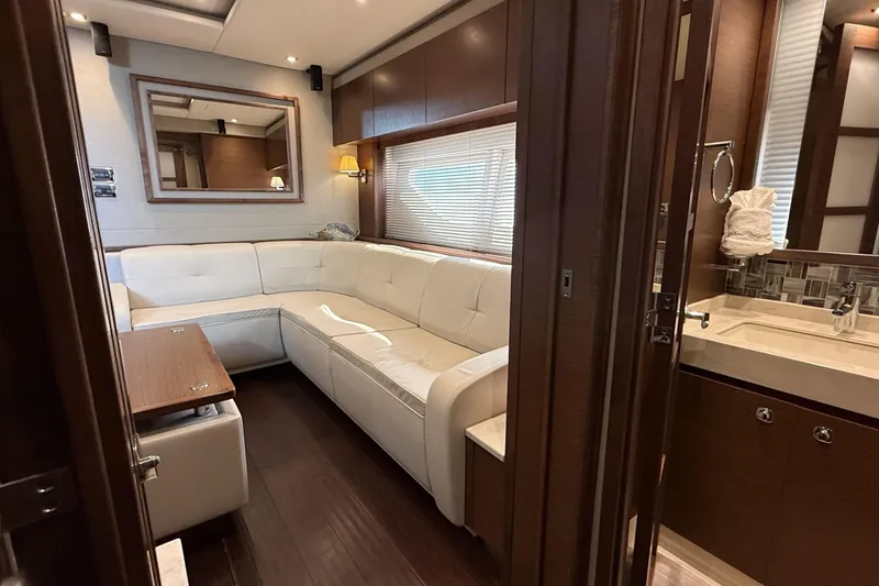  Yacht Photos Pics Luxurious interior of 2014 Sea Ray 540 Sundancer yacht with white leather seating.