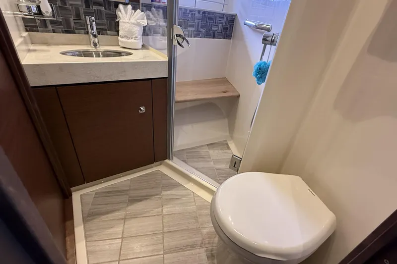  Yacht Photos Pics Luxurious bathroom in 2014 Sea Ray 540 Sundancer yacht with modern fixtures and shower.