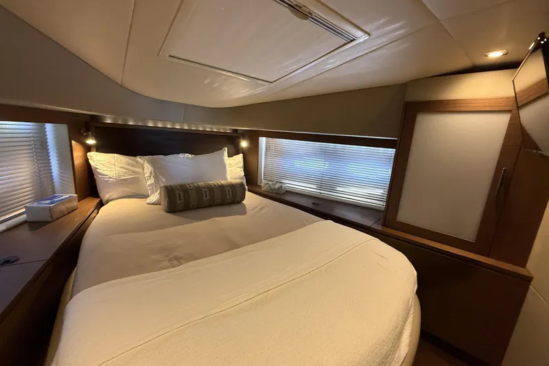  Yacht Photos Pics Luxurious bedroom interior of 2014 Sea Ray 540 Sundancer yacht with cozy bedding.
