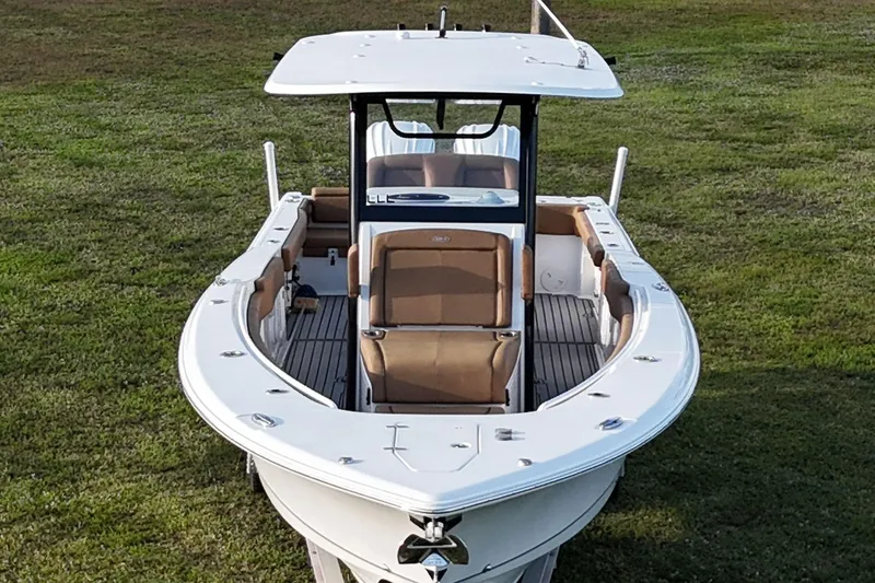  Yacht Photos Pics 2023 Seahunt 30 GameFish Coffin Box boat on grassy field, front view.