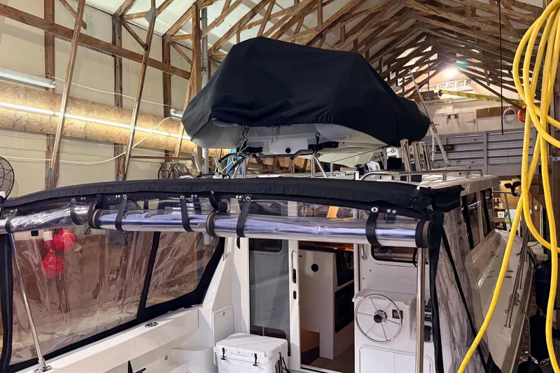 Kapalua Yacht Photos Pics 2013 Ocean Sport Roamer 33 boat in a wooden storage facility.