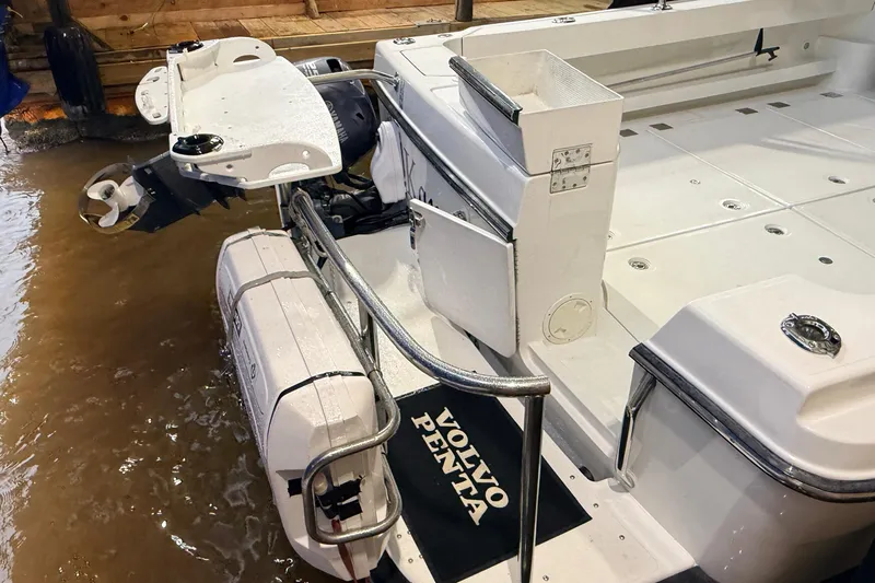 Kapalua Yacht Photos Pics 2013 Ocean Sport Roamer 33 boat with Volvo Penta engine, docked in water.