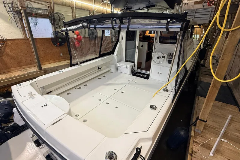 Kapalua Yacht Photos Pics 2013 Ocean Sport Roamer 33 boat interior with spacious deck and steering area.