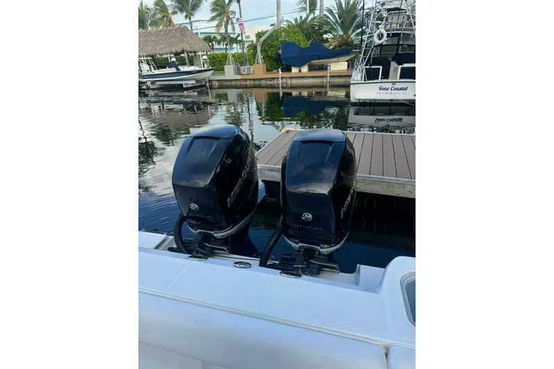  Yacht Photos Pics Twin outboard engines on a 2016 Boston Whaler 320 Outrage at a dock.