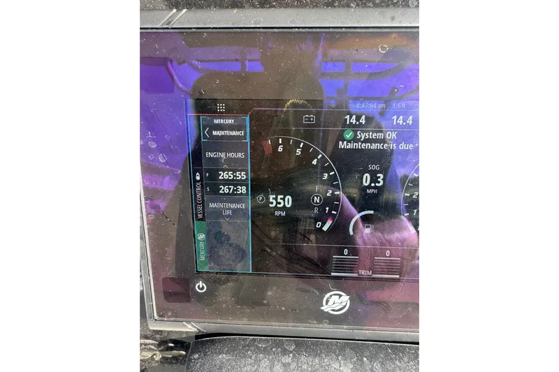  Yacht Photos Pics Dashboard of a 2016 Boston Whaler 320 Outrage showing engine hours and maintenance status.