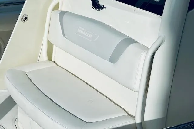  Yacht Photos Pics 2016 Boston Whaler 320 Outrage boat seat, white cushioned design, close-up view.