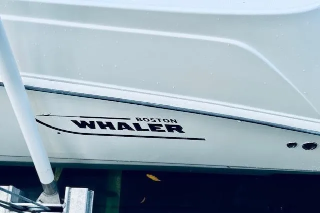  Yacht Photos Pics 2016 Boston Whaler 320 Outrage boat hull with logo visible.